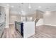 Modern open-concept kitchen features a central island with stainless steel appliances and plenty of storage at 2041 Greenbriar Ter, Davenport, FL 33837