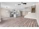 Bright living room featuring wood floors, recessed lighting, and an open layout with modern stairs at 2041 Greenbriar Ter, Davenport, FL 33837