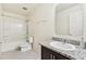 Clean bathroom with a shower-tub combo and vanity, offering a convenient and functional space at 2215 Upland Ln, Apopka, FL 32712