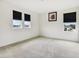 An empty bedroom with neutral carpet, white walls, black out blinds, and three windows for natural light at 2215 Upland Ln, Apopka, FL 32712