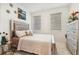 Bright bedroom with large windows, stylish decor, and plenty of natural light at 2215 Upland Ln, Apopka, FL 32712