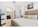 Comfortable bedroom featuring a bed with upholstered headboard and en-suite bathroom at 2215 Upland Ln, Apopka, FL 32712