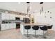 Well-appointed kitchen with stainless steel appliances, a large island with barstools, and granite countertops at 2215 Upland Ln, Apopka, FL 32712