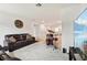 Open-concept living room with comfortable seating and a drum set at 2215 Upland Ln, Apopka, FL 32712