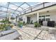 Relaxing screened-in patio with plenty of room for lounge seating and outdoor activities at 2215 Upland Ln, Apopka, FL 32712