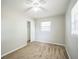 Comfortable bedroom with plush carpet, closet, and a bright window at 2307 Freemason St, Lakeland, FL 33801