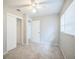 This bedroom features neutral walls, ceiling fan, carpet flooring, closet, and a window at 2307 Freemason St, Lakeland, FL 33801