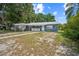 Charming single-story home with a covered parking area and freshly painted exterior at 2307 Freemason St, Lakeland, FL 33801