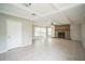 Bright living room with tile flooring and a charming brick fireplace at 2307 Freemason St, Lakeland, FL 33801