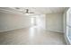 Large, bright living room with tile floors and neutral wall color at 2307 Freemason St, Lakeland, FL 33801