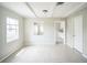 Neutral living room with tile flooring, a window, and white ceilings at 2307 Freemason St, Lakeland, FL 33801