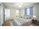 Serene main bedroom with plush carpet, neutral decor, and ample natural light at 2307 Freemason St, Lakeland, FL 33801