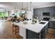 Spacious kitchen boasts a large island, modern appliances, and open layout to the dining and living areas at 2530 Raghav Trl, Tavares, FL 32778