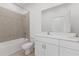 This bathroom features a shower and tub combo, a toilet, and a vanity with double sinks at 2533 Raghav Trl, Tavares, FL 32778