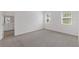 Bedroom with carpet and view of bathroom at 2533 Raghav Trl, Tavares, FL 32778