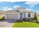 Charming single-Gathering home with a two-car garage, well-maintained lawn, and inviting curb appeal at 2533 Raghav Trl, Tavares, FL 32778