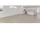 Bright open floor plan with kitchen island and stainless steel appliances at 2533 Raghav Trl, Tavares, FL 32778