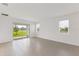 Bright living room with tile floors, natural light, and sliding glass doors at 2533 Raghav Trl, Tavares, FL 32778