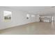 Bright living room with tile floors, ample natural light, and open layout at 2533 Raghav Trl, Tavares, FL 32778