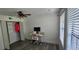 Bright bedroom featuring a ceiling fan, closet and a desk with natural light from the windows at 320 Forestway Cir # 107, Altamonte Springs, FL 32701