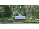 Entrance sign for Lakewood Park at Altamonte Springs amidst lush greenery and mature trees at 320 Forestway Cir # 107, Altamonte Springs, FL 32701