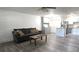 Open living area with modern flooring, neutral walls, and adjacent kitchen at 320 Forestway Cir # 107, Altamonte Springs, FL 32701