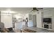 Open-concept living space featuring a stylish kitchen, built-in shelving, and a comfortable sofa at 320 Forestway Cir # 107, Altamonte Springs, FL 32701