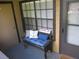 Cozy patio with a cushioned bench, decorative pillows, and neutral color scheme at 320 Forestway Cir # 107, Altamonte Springs, FL 32701