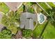 Aerial view of a home and pool surrounded by lush landscaping at 359 Westwind Ct, Lake Mary, FL 32746