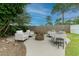 Landscaped backyard with a modern fire pit area, surrounded by comfortable seating at 359 Westwind Ct, Lake Mary, FL 32746