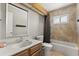 Well-lit bathroom featuring a vanity with a marble countertop, a tub, and tiled walls at 359 Westwind Ct, Lake Mary, FL 32746