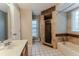 Modern bathroom with tile accents, updated fixtures, and glass door shower at 359 Westwind Ct, Lake Mary, FL 32746
