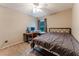 Neutral bedroom with ceiling fan, carpet, desk, and metal bedframe near window at 359 Westwind Ct, Lake Mary, FL 32746