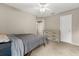 Bright bedroom with a grey bed, a wooden dresser, and a large window at 359 Westwind Ct, Lake Mary, FL 32746