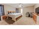 Comfortable bedroom with carpet, ceiling fan and rustic wood furniture at 359 Westwind Ct, Lake Mary, FL 32746