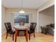 Cozy dining area featuring a round table, three chairs, and natural light at 359 Westwind Ct, Lake Mary, FL 32746