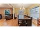 Dining and Living Room featuring an open layout with wood-look floors at 359 Westwind Ct, Lake Mary, FL 32746