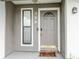 Inviting front door with decorative window and modern hardware, enhancing curb appeal at 359 Westwind Ct, Lake Mary, FL 32746