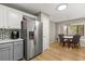 Bright kitchen features stainless steel appliances, a refrigerator, and a breakfast nook with a view to enjoy at 359 Westwind Ct, Lake Mary, FL 32746
