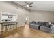 Open living area with a vaulted ceiling, a large sofa and a pass-through to the kitchen, promoting social interactions at 359 Westwind Ct, Lake Mary, FL 32746