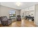 Bright and airy living room featuring hardwood floors and comfortable seating, creating a welcoming atmosphere at 359 Westwind Ct, Lake Mary, FL 32746
