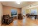 Open-concept living and dining area with wood floors and modern lighting at 359 Westwind Ct, Lake Mary, FL 32746