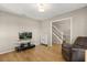 Cozy living space with a TV and entertainment center, next to a stairway, perfect for relaxing and entertainment at 359 Westwind Ct, Lake Mary, FL 32746