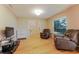 Bright living room with wood floors, comfortable seating, and lots of natural light at 359 Westwind Ct, Lake Mary, FL 32746