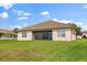 This house has a spacious backyard and screened-in patio perfect for outdoor relaxation at 3847 Shoreside Dr, Kissimmee, FL 34746
