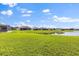 The backyard includes a well-maintained lawn and scenic water views at 3847 Shoreside Dr, Kissimmee, FL 34746