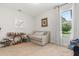 This bedroom offers a twin sized bed, ample natural light, and neutral-toned decor at 3847 Shoreside Dr, Kissimmee, FL 34746