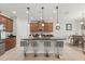 Stylish kitchen with granite countertops, stainless steel appliances, and modern bar stool seating at 3847 Shoreside Dr, Kissimmee, FL 34746