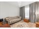 Comfortable living room with a tufted sofa, area rug, and natural light at 3847 Shoreside Dr, Kissimmee, FL 34746
