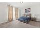 Inviting primary bedroom with soft lighting, neutral decor, and plush carpeting at 3847 Shoreside Dr, Kissimmee, FL 34746